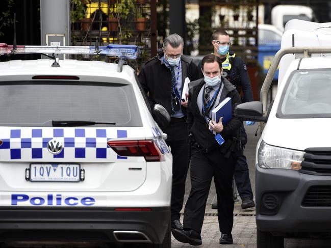 Police surround the scene of the double stabbing. Picture: Andrew Henshaw