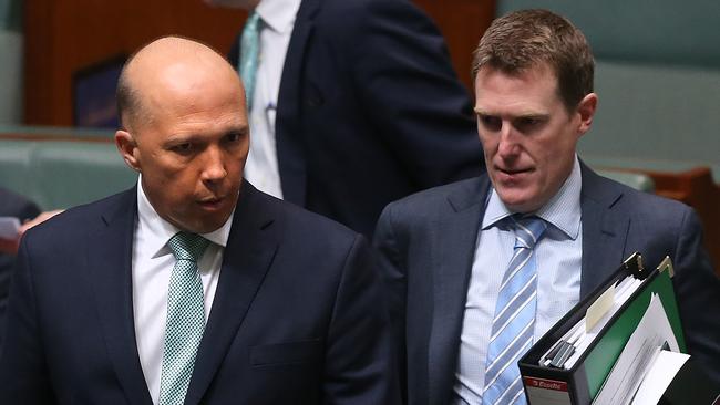 Peter Dutton and Christian Porter in the Representatives Chamber at Parliament House in Canberra. Picture: Kym Smith