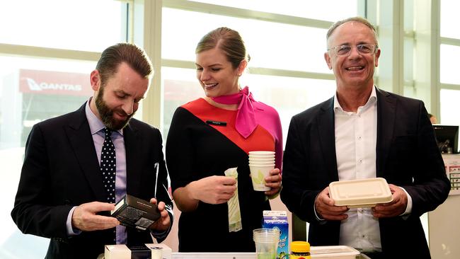 Qantas group executive for sustainability Andrew Parker, left, Qantas flight attendant Madeline Rowcliff and Qantas Domestic CEO Andrew David. Picture: AAP