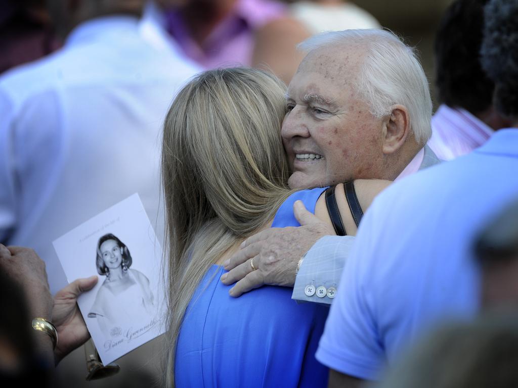 Alan Bond is consoled after suffering the loss of his wife Di Bliss in 2012. Picture: News Corp