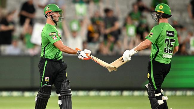 MELBOURNE, AUSTRALIA - JANUARY 16: Marcus Stoinis and Hilton Cartwright of the Stars celebrate the Stars winning the Men's Big Bash League match between the Melbourne Stars and the Brisbane Heat at Melbourne Cricket Ground, on January 16, 2022, in Melbourne, Australia. (Photo by Morgan Hancock/Getty Images)