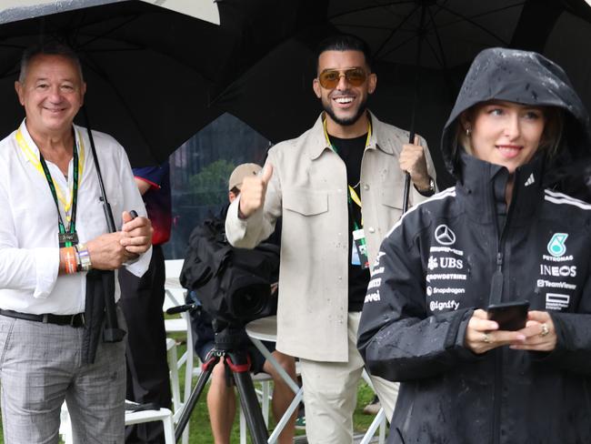 MELBOURNE, AUSTRALIA - MARCH 16: Billionaire Adrian Portelli (C) attends the F1 Grand Prix of Australia at Albert Park Grand Prix Circuit on March 16, 2025 in Melbourne, Australia. Picture: Angelica Snowden / The Australian