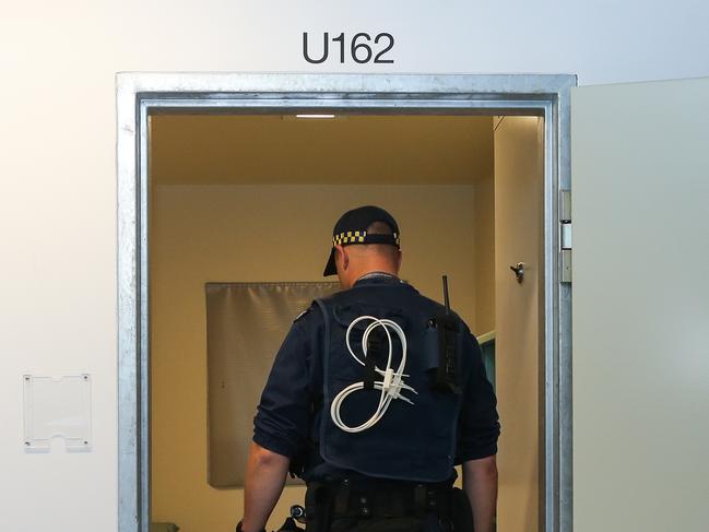 SYDNEY, AUSTRALIA - NewsWire Photos NOVEMBER 23, 2020: A correctional officer is seen with a drug sniffer dog inspecting the maximum security cells during the official opening of the Dillwynia Correctional Centre in Windsor. Australia's largest women's prison focusing on education, work skills and programs and home to 531 women after the expansion, in Sydney Australia. Picture: NCA NewsWire / Gaye Gerard