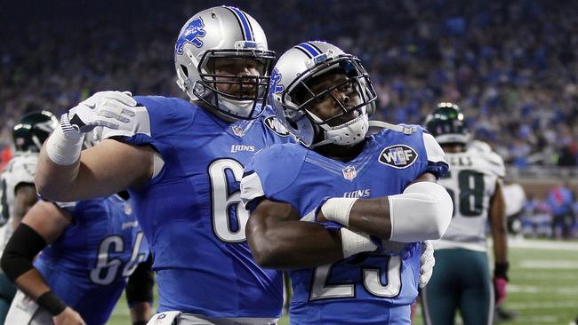 Detroit Lions running back Theo Riddick (25) reacts after his 17-yard touchdown run.