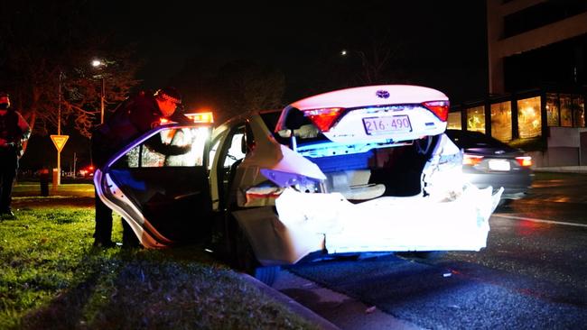 The car as damaged in the front and the back after being rammed.