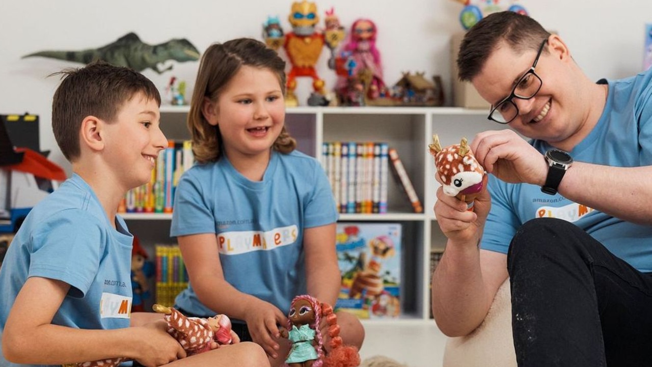 NSW 7-year-old Amelia and her brother Louis play with toys with Johnny Ruffo, who has terminal brain cancer. Picture: Supplied