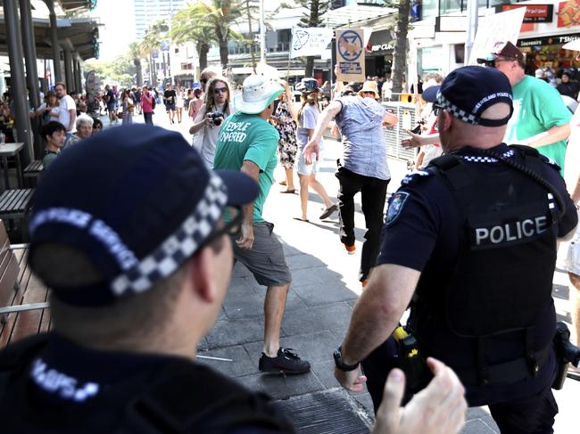Police move in on the pair. Picture: Nigel Hallett