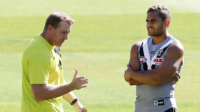 Port Adelaide assistant coach Michael Voss talks to Dom Barry at training in April. Picture: Sarah Reed