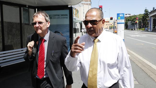 Rohana Samarasekera (right) leaves the Brisbane Magistrates Court after making his first appearance in 2017. Picture: AAP Image