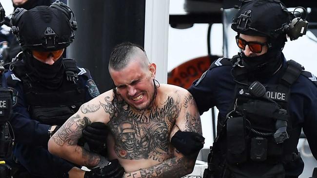 A man has surrendered himself to police following a boat standoff on the Sunshine Coast after he allegedly crashed a car through a home with teary owners saying it sounded like a bomb going off. Picture: Patrick Woods.