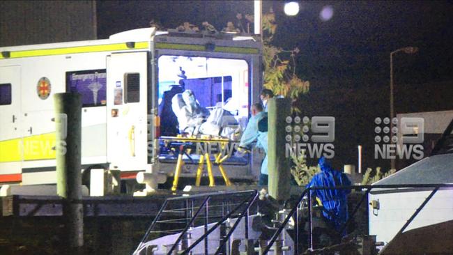 Water police transported two COVID-19 positive patients from a cargo ship to Townsville where they will be treated. Photo: 9 News North Queensland