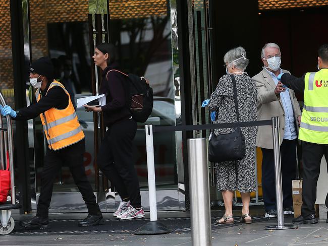 Travellers are released from the Crown Promenade Hotel in Melbourne after 14 days quarantine. Picture: Ian Currie