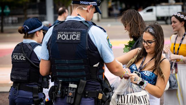 Police swap friendship bracelets with People arriving for the fourth and last Taylor Swift Concert at Olympic Park Picture: NCA NewsWire/ Ben Symons