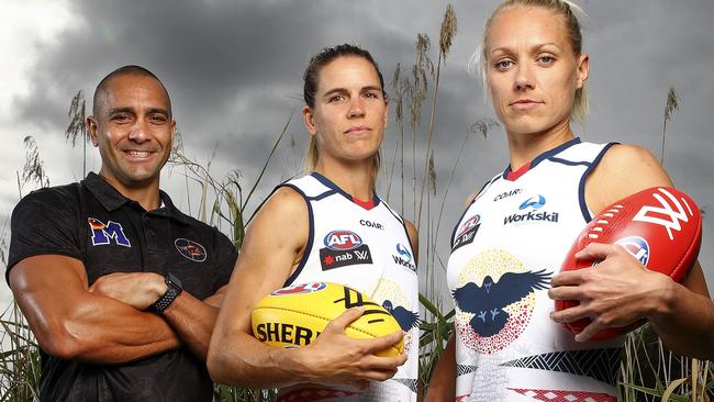 Crows legend Andrew McLeod with co-captains Chelsea Randall and Erin Phillips as he unveils the indigenous jumper he designed for the new Adelaide women’s team. Picture: Sarah Reed