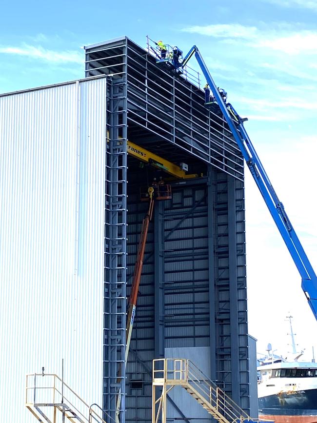 Workers on the fit the facade of the $16m abrasive blasting and painting shed. Picture: Supplied