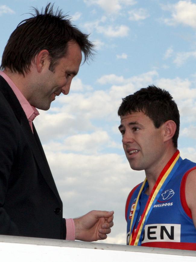 Darryl Wakelin presents Ian Callinan with the Jack Oatey Medal after the 2010 SANFL Grand Final.