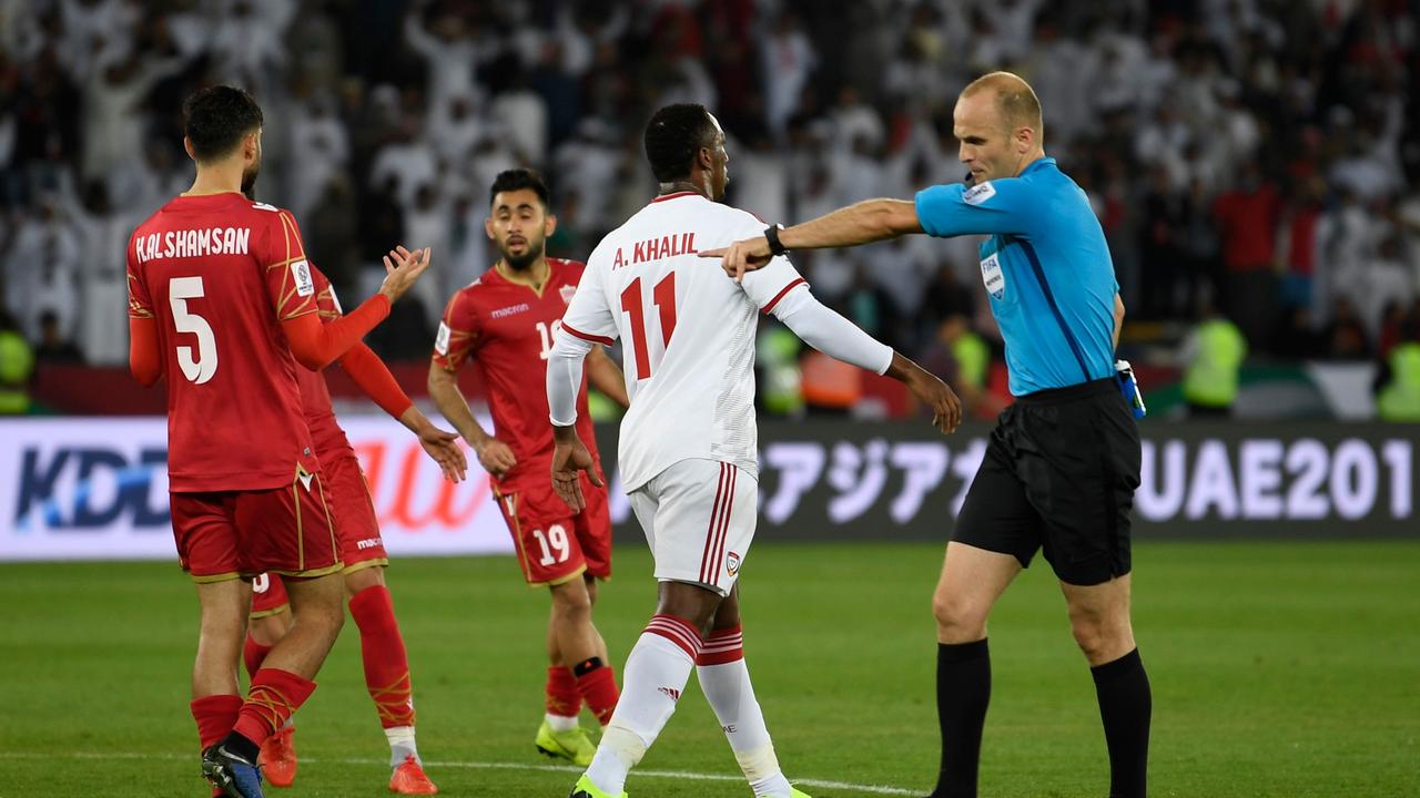 The referee points to the spot to give UAE a lifeline in the Asian Cup opener.