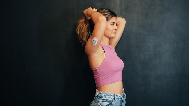 A woman with diabetes wearing a small sensor on the back of her upper arm for measuring glucose levels 24/7. Picture: iStock