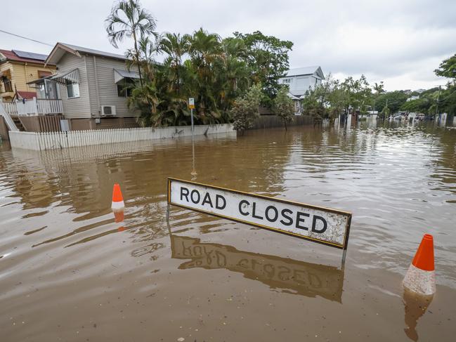 BRISBANE, AUSTRALIA - MARCH 03: A road closed sign in a flooded Torwood Street, Auchenflower on March 03, 2022 in Brisbane, Australia. From Brisbane in Queensland to Lismore in northern New South Wales, flood-affected communities are cleaning up debris as the weather system moves south towards Sydney. (Photo by Peter Wallis/Getty Images)