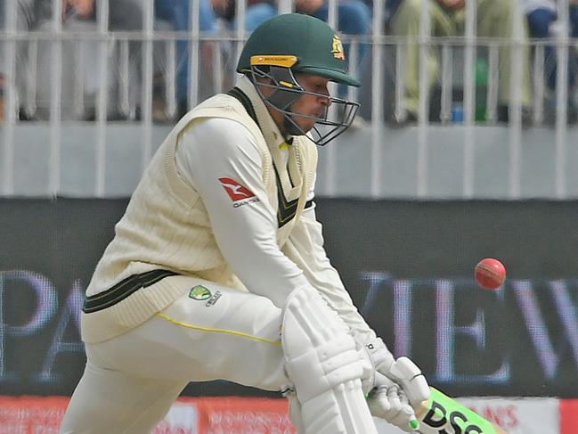 Australia's Usman Khawaja plays a shot during the third day of the first Test cricket match between Pakistan and Australia at the Rawalpindi Cricket Stadium in Rawalpindi on March 6, 2022. (Photo by Aamir QURESHI / AFP)