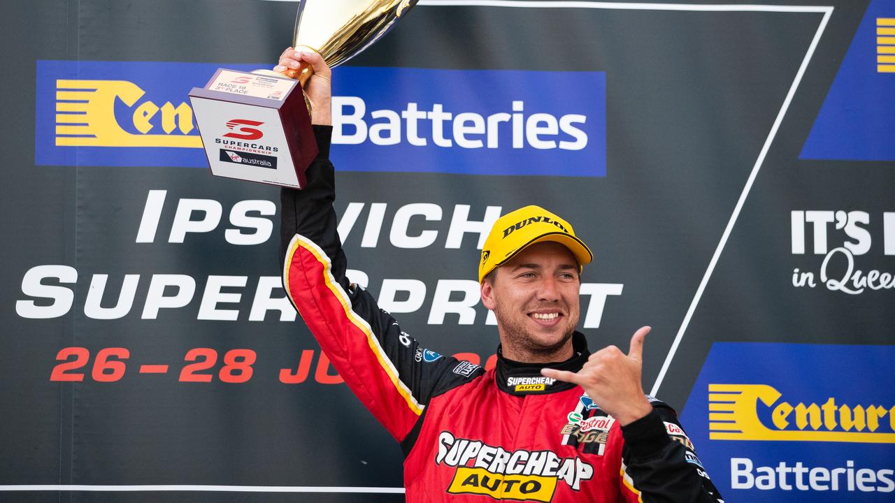 Chaz Mostert celebrates on the podium at Queensland Raceway last month.