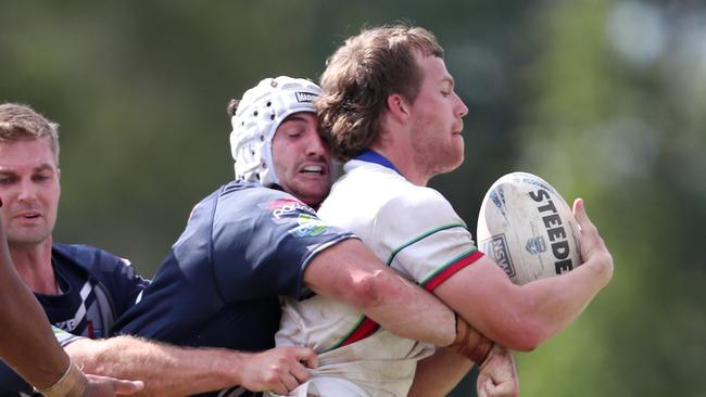 Newcastle’s Matt Soper-Lawler tackling Monaro winger Braden Withers. Picture: Sue Graham