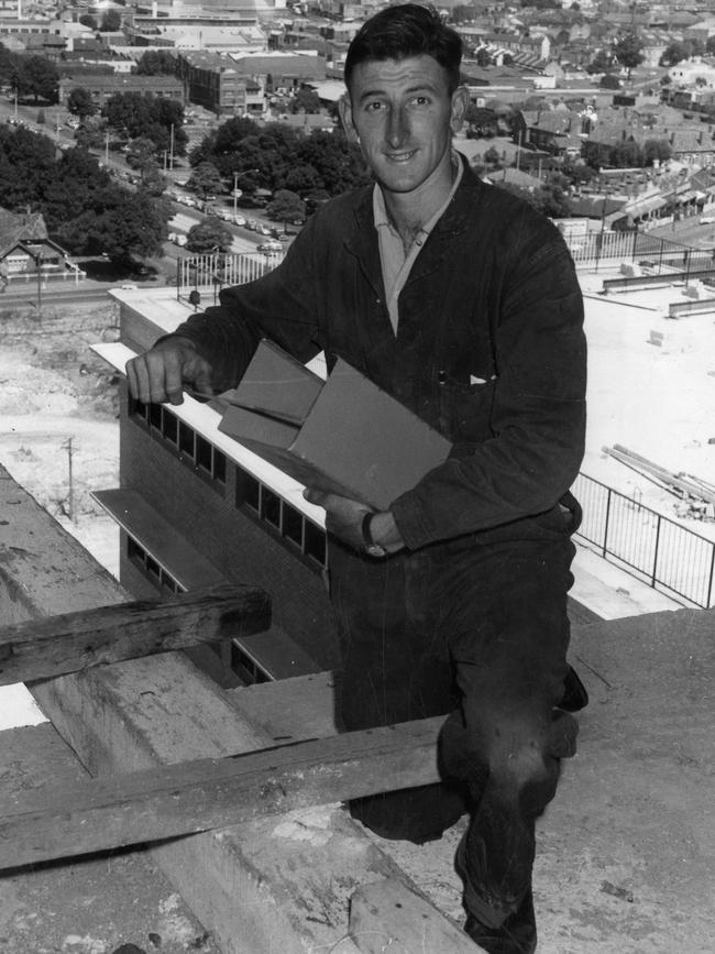 Cricketer Bill Lawry at work as a plumber on the 13th floor of the new Royal Children's Hospital construction in 1961. Picture: Herald &amp; Weekly Times