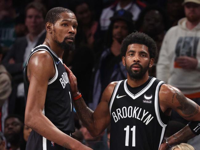 NEW YORK, NEW YORK - APRIL 23: Kevin Durant #7 and Kyrie Irving #11 of the Brooklyn Nets look on in the final seconds of their 109-103 loss against the Boston Celtics during Game Three of the Eastern Conference First Round NBA Playoffs at Barclays Center on April 23, 2022 in New York City. NOTE TO USER: User expressly acknowledges and agrees that, by downloading and or using this photograph, User is consenting to the terms and conditions of the Getty Images License Agreement.   Al Bello/Getty Images/AFP. == FOR NEWSPAPERS, INTERNET, TELCOS & TELEVISION USE ONLY ==