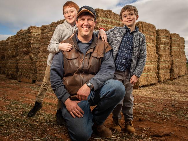 Rural Aid and Qantas hay drop 90 min outside of Adelaide at Eudunda where appx 40 local farmers gathered to pick up hay and feed pellets for their stock. Adelaide brothers and singers Ethan 11 and Toby 7 Hall raised $9500 by busking to donate to drought affected farmers like Karl Zerner. PICTURE: Brad Fleet