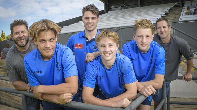 Sturt under-16 talents with their footballing family members (from left) Brodie and Ned Atkinson, Jed and Kobe McEntee, and Luca and Matthew Slade. Picture: Roy VanDerVegt