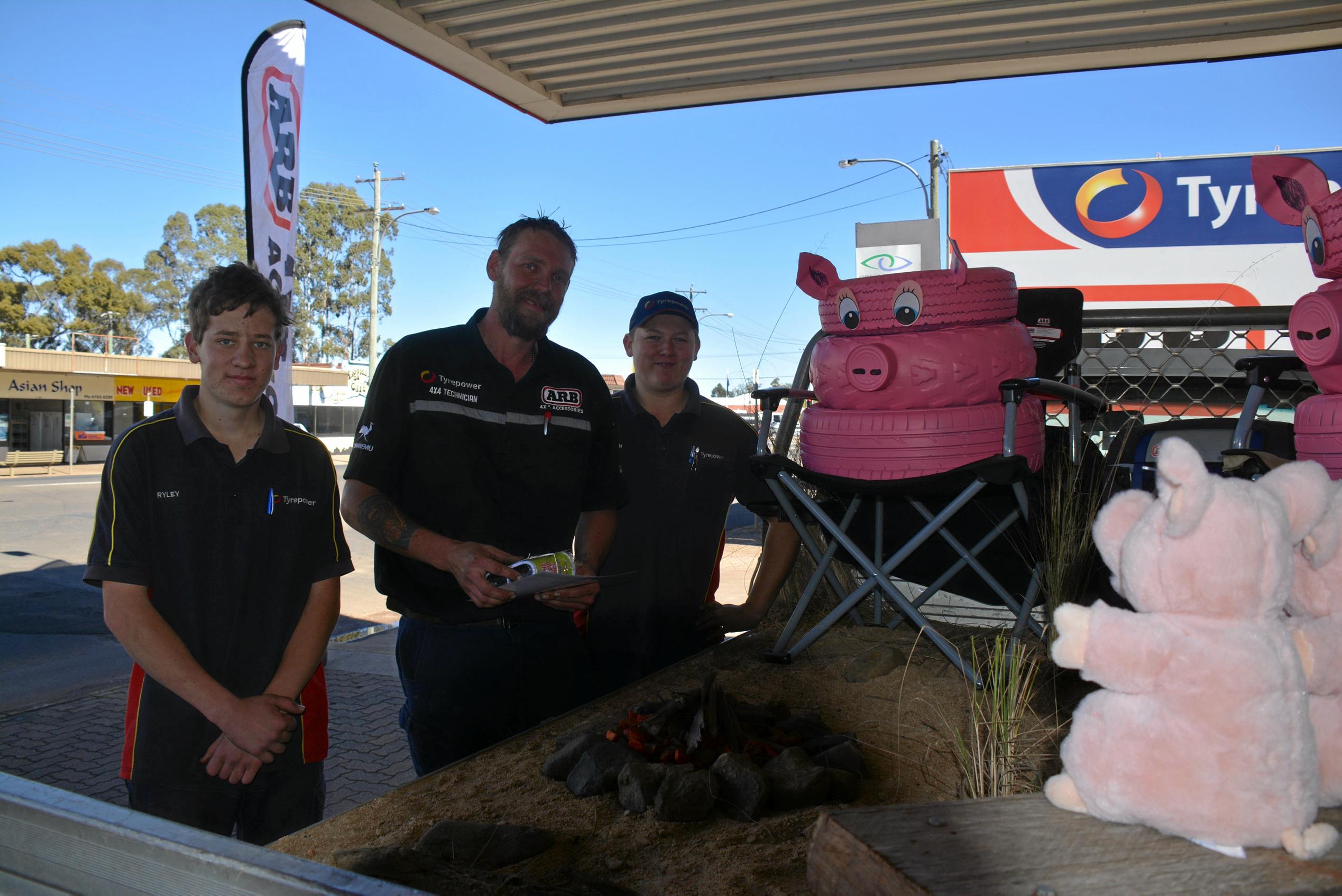 CAMPFIRE: Ryley Kaehler, Dion Hetherington and Aaron Holmes from Cooper Tires earned a highly commended with their piggy campfire display for the BaconFest Street Window competition. Picture: Jessica McGrath