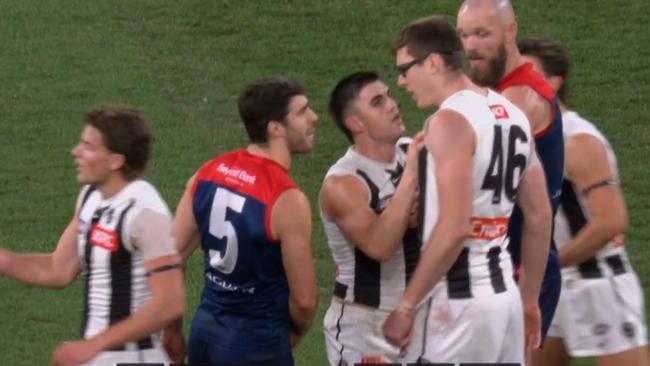 Mason Cox and Christian Petracca had words. Photo: Fox Footy.