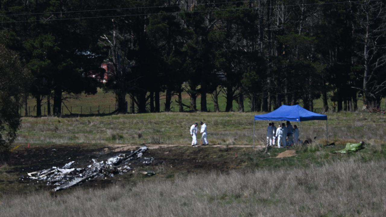 Investigators are seen taking away evidence to a shade shelter in the same paddock. Picture: NCA NewsWire/ Martin Ollman