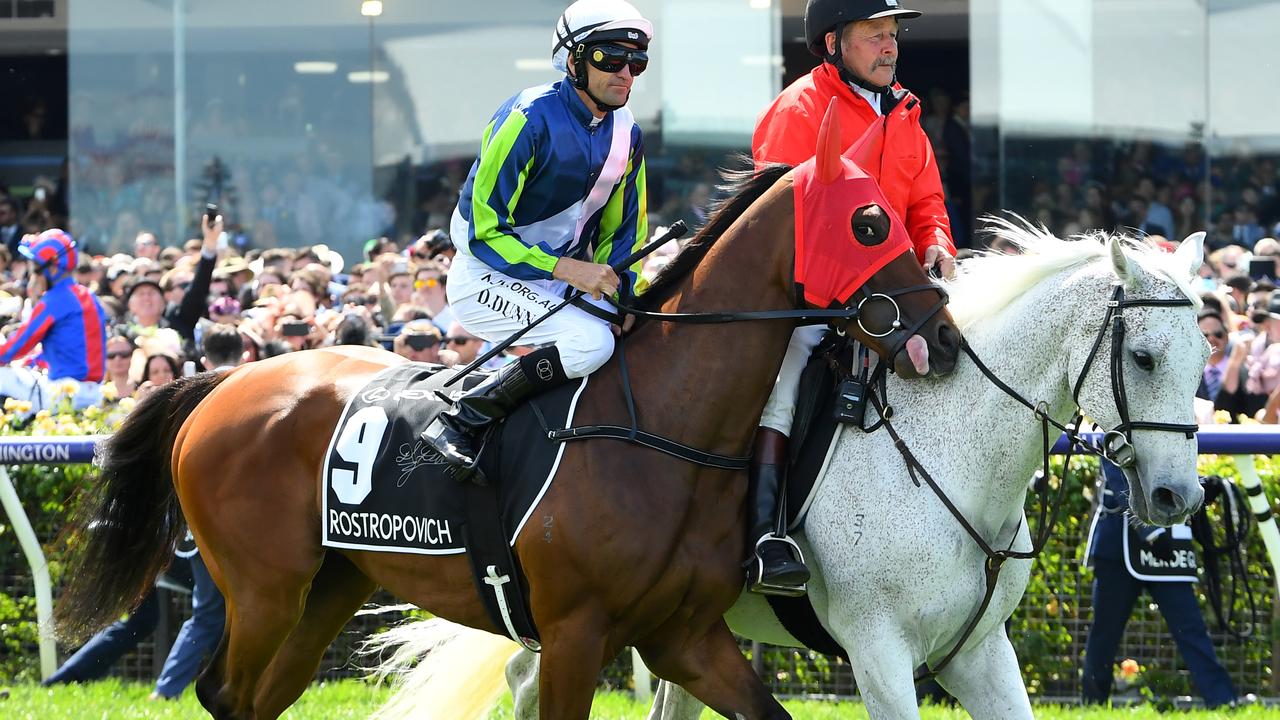 Jockey Dwayn Dunn (left) enters the field on Rostropovich ahead of race 7, the Lexus Melbourne Cup at Flemington Racecourse in Melbourne, Tuesday, November 5, 2019. (AAP Image/James Ross) NO ARCHIVING, EDITORIAL USE ONLY