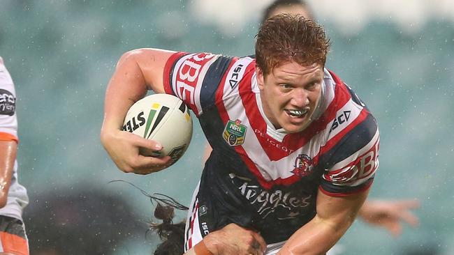 SYDNEY, AUSTRALIA — JUNE 05: Dylan Napa of the Roosters is tackled during the round 13 NRL match between the Sydney Roosters and the Wests Tigers at Allianz Stadium on June 5, 2016 in Sydney, Australia. (Photo by Mark Kolbe/Getty Images)