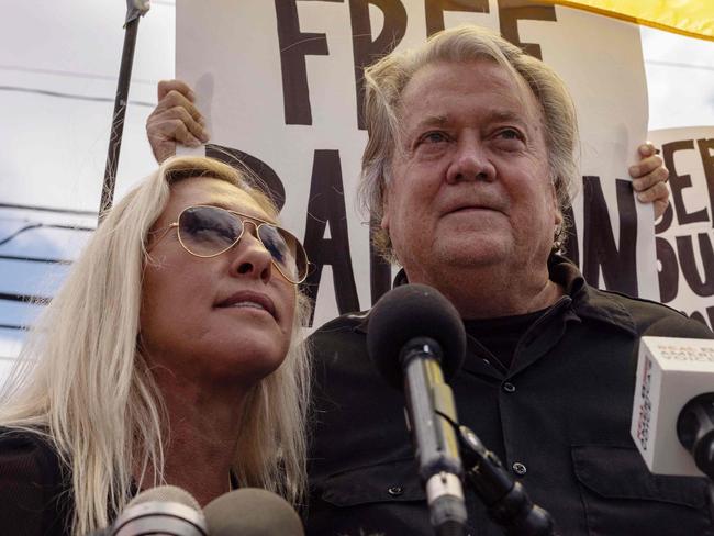 Former White House Chief Strategist Steve Bannon (R) and US Representative Marjorie Taylor Greene (L), Republican of Georgia, speak during a press conference outside the federal correctional institution, on July 1, 2024 in Danbury, Connecticut. Former top Donald Trump advisor Steve Bannon is expected to report to prison by July 1 to begin serving his four-month sentence for contempt of Congress. (Photo by Yuki IWAMURA / AFP)