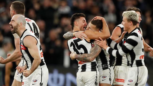 Nick Daicos celebrates with Jamie Elliott after the final siren on Sunday. Picture: Dylan Burns/AFL Photos