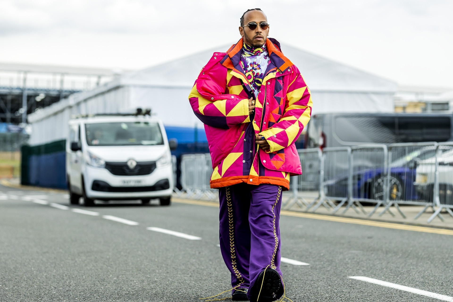 Lewis Hamilton Wears Louis Vuitton Souvenir Jacket and Sneakers at