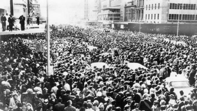 Crowds of fans who came to see The Beatles flood King William Street on June 12, 1964. Picture: Advertiser Library