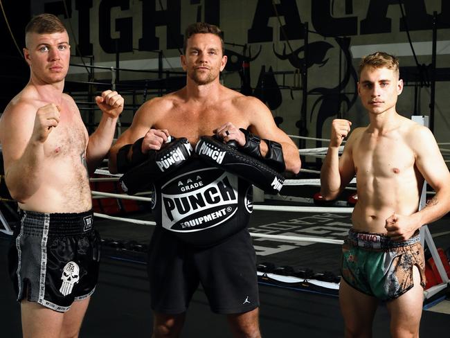 Jack Chalker (left) scored a victory but Jesse Clarke (right), pictured with DF Gym coach Patrick Doherty, lost the Elite Fight Series title bout on Saturday night at the Brothers Leagues Club.