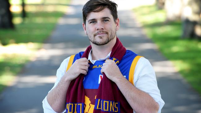 Herald Sun reporter Kieran Rooney with his footy scarf. He has been refused entry to bars when wearing footy colours. Picture: Andrew Henshaw