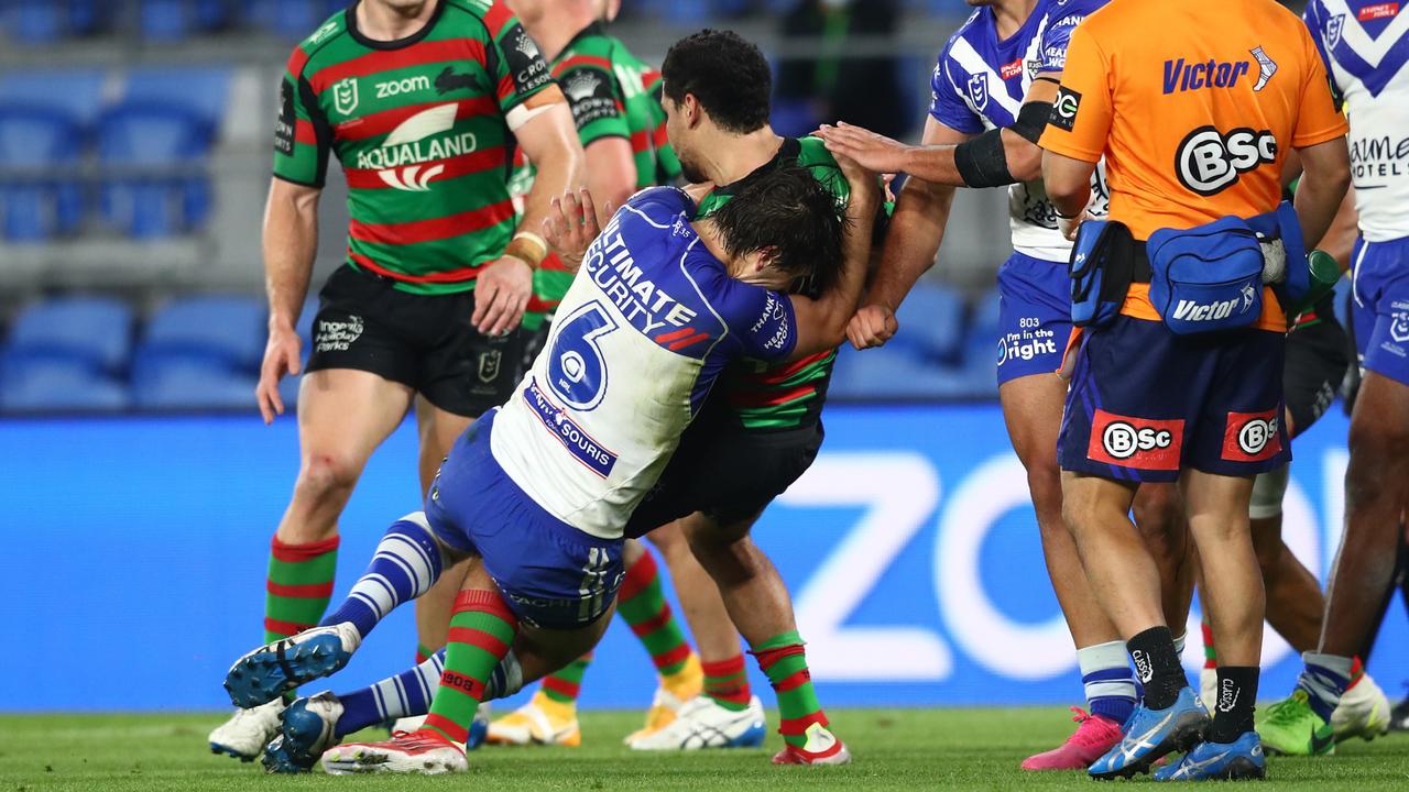 Lachlan Lewis tackled Cody Walker in bizarre scenes as the teams left the field for half-time. Picture: Chris Hyde/Getty Images