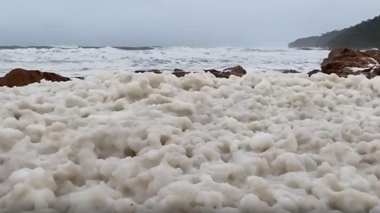 First Bay Coolum in Queensland has been overrun with a white lathery foam. Picture: Storyful