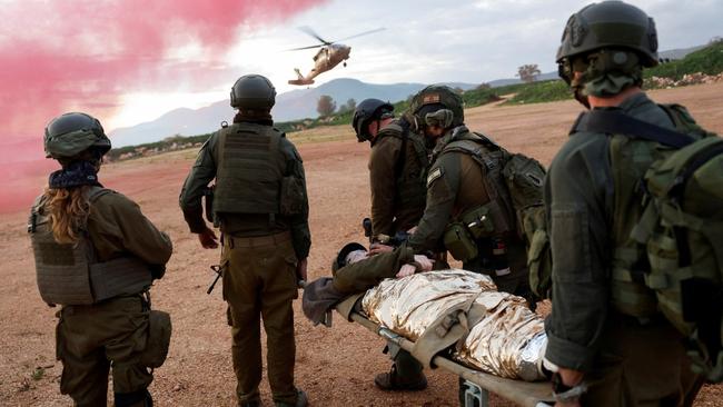 Israeli soldiers practice evacuating wounded people during a military drill. Picture: Reuters