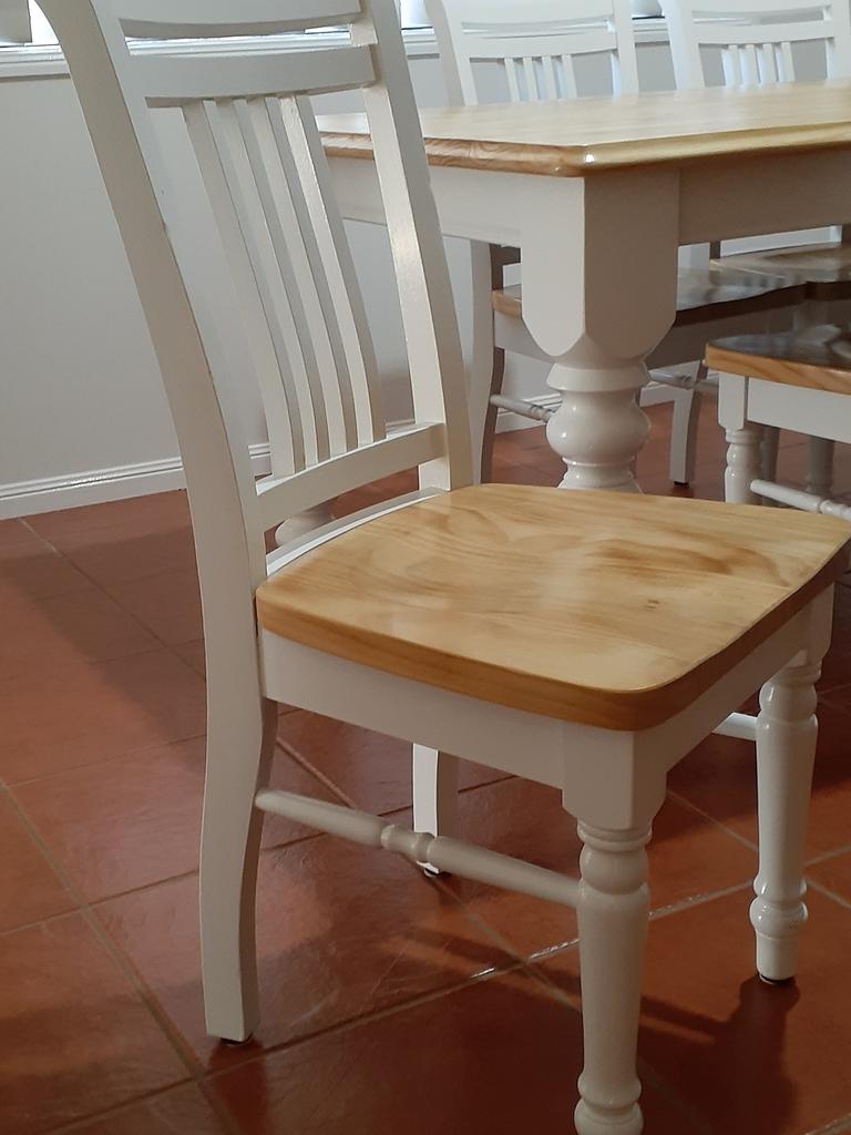 She stripped the colour back by sanding the chair seats and table top. Picture: Supplied