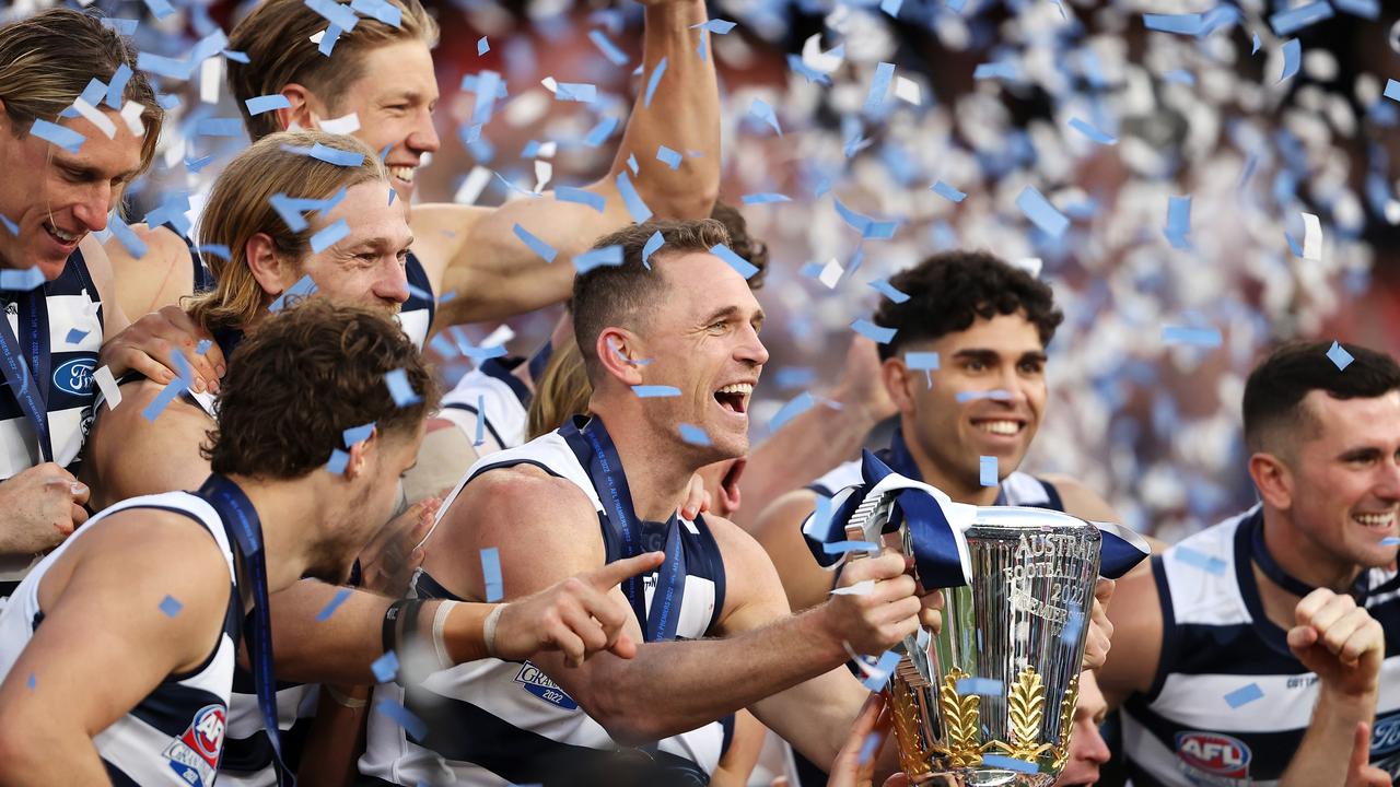 Joel Selwood of the Geelong Cats and his team celebrate with the trophy as they celebrate victory during the 2022 AFL Grand Final. Photo by Mark Kolbe/AFL Photos/via Getty Images