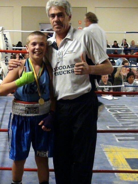 Mitchel Stapleton winning his first national title as a 10-year-old, seen here with his dad Ian.