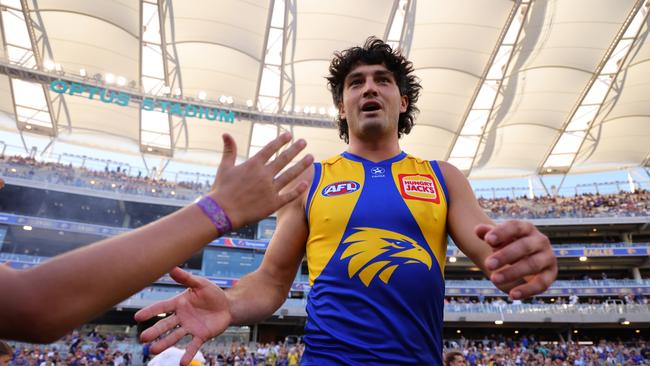 PERTH, AUSTRALIA - MARCH 24: Tom Barrass of the Eagles high fives as he runs out onto the ground during the round two AFL match between West Coast Eagles and Greater Western Sydney Giants at Optus Stadium, on March 24, 2024, in Perth, Australia. (Photo by James Worsfold/AFL Photos/via Getty Images )