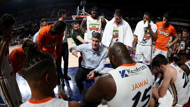 Taipans Head coach Mike Kelly speaks to his players during a time out during the Round 19 NBL match between the Adelaide 36ers and the Cairns Taipans at Adelaide Entertainment Centre in Adelaide, Saturday, February 8, 2020. (AAP Image/Kelly Barnes)