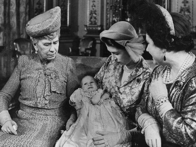 Princess Elizabeth (later Queen Elizabeth II) holding baby daughter Anne with her mother Queen Elizabeth (right) and her grandmother Queen Mary. Picture: Getty Images